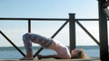 Young woman practicing yoga outdoors in summer. Healthy lifestyle