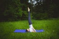 Young woman practicing yoga in the park,Yoga-Salamba Sarvangasana Supported Shoulderstand Royalty Free Stock Photo