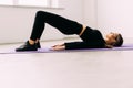 Young woman practicing in a yoga studio. Thsi is called reverse plank pose, its a heart opener pose Royalty Free Stock Photo