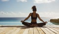 Young woman practicing yoga by a swimming pool with ocean in the background. Royalty Free Stock Photo