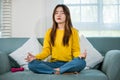 Young woman practise yoga and meditation in lotus position