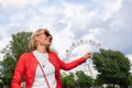 Young woman in the Prater area on the background of the Vienna Ferris Wheel Royalty Free Stock Photo