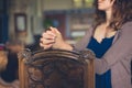 Young woman praying in church Royalty Free Stock Photo