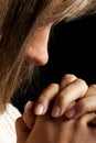 Young woman praying, close up. Royalty Free Stock Photo