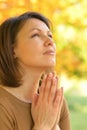 Close up portrait of young woman praying Royalty Free Stock Photo