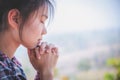 Young woman praying with hand, prayer concept for faith, spirituality and religion