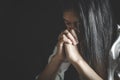 Young woman praying with hand, prayer concept for faith, spirituality and religion