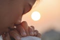 Young woman praying with hand, prayer concept for faith, spirituality and religion