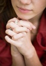 Young woman with praying hands and beautiful lips Royalty Free Stock Photo