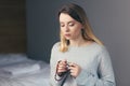 Young woman prays to God, folded her arms on her chest uses a rosary and a crucifix