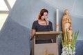 Young woman preaching in christian church