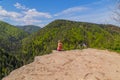 Young woman on the precipice