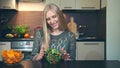 Young woman preferring salad to crisp.