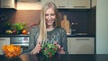 Young woman preferring salad to crisp.