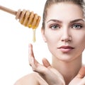 Young woman prepare for honey facial mask.