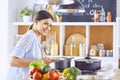 A young woman prepares food in the kitchen. Healthy food - vegetable salad. Diet. The concept of diet. Healthy lifestyle