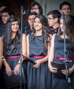 Young woman prepares for solo performance in choir