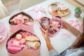 Young woman preparing birthday gift box set of natural bath supplies for body care.