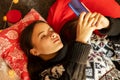 Young woman preparing for christmas, shopping online, choosing gifts on sale