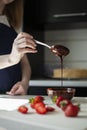 A young woman is preparing cream for a cake. Happy day. Royalty Free Stock Photo