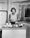 Young woman preparing food in the kitchen Royalty Free Stock Photo