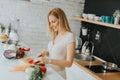 Young woman preparing healthy meal in the modern kitchen Royalty Free Stock Photo