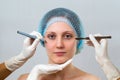 Young woman preparing for plastic surgery in cosmetic clinic Royalty Free Stock Photo