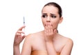 The young woman preparing for plastic surgery on white Royalty Free Stock Photo