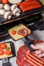 Young woman is preparing a traditional Swiss cheese raclette