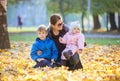 Young woman with preschool son and baby daugther enjoying beautiful day Royalty Free Stock Photo