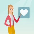 Young woman pressing heart shaped button. Royalty Free Stock Photo