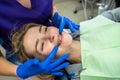 young woman with problem teeth came to the dentist to treat teeth.