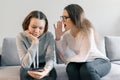 Young woman professional psychotherapist talking with teen girl in office. Mental health of child in adolescence