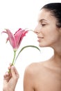 Young woman profile smelling lily Royalty Free Stock Photo