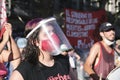 Young woman with protective mask during a rally in favor of the legal abortion