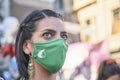 Young woman with a protective mask during a rally in favor of the legal abortion
