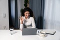 Young woman a psychotherapist doctor having online psychotherapy therapy with her patient on video call on the laptop computer Royalty Free Stock Photo