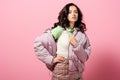 Young woman in puffer jacket posing