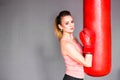 Young woman with punching bag Royalty Free Stock Photo