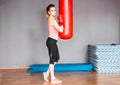 Young woman with punching bag Royalty Free Stock Photo