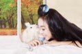 Young woman with a puppy licking her Royalty Free Stock Photo
