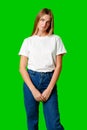 Young Woman With Pursed Lips Expressing Skepticism Against Green Screen Background