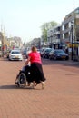 Young woman pushes on an old woman in a wheelchair, Netherlands