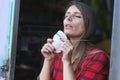 young woman putting face mask for polluted air