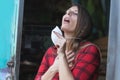 young woman putting face mask for polluted air