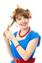 Young woman putting on hair curlers