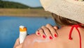 Young woman putting sun lotion on summer vacation Royalty Free Stock Photo