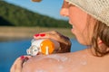 Young woman putting sun lotion on summer vacation Royalty Free Stock Photo