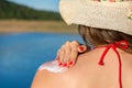 Young woman putting sun lotion on summer vacation Royalty Free Stock Photo