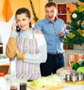 Young woman after quarrel with husband, he trying conversate Royalty Free Stock Photo